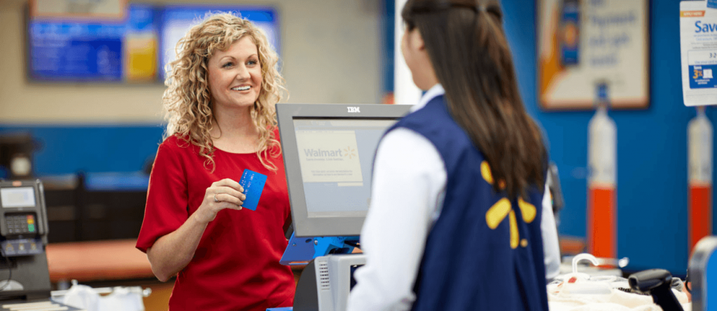 Customer using Walmart MoneyCard at the register