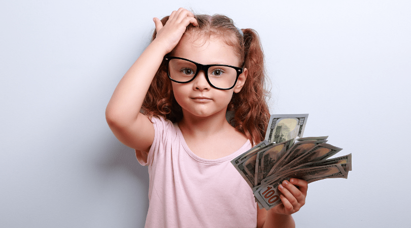 Confused girl holding cash